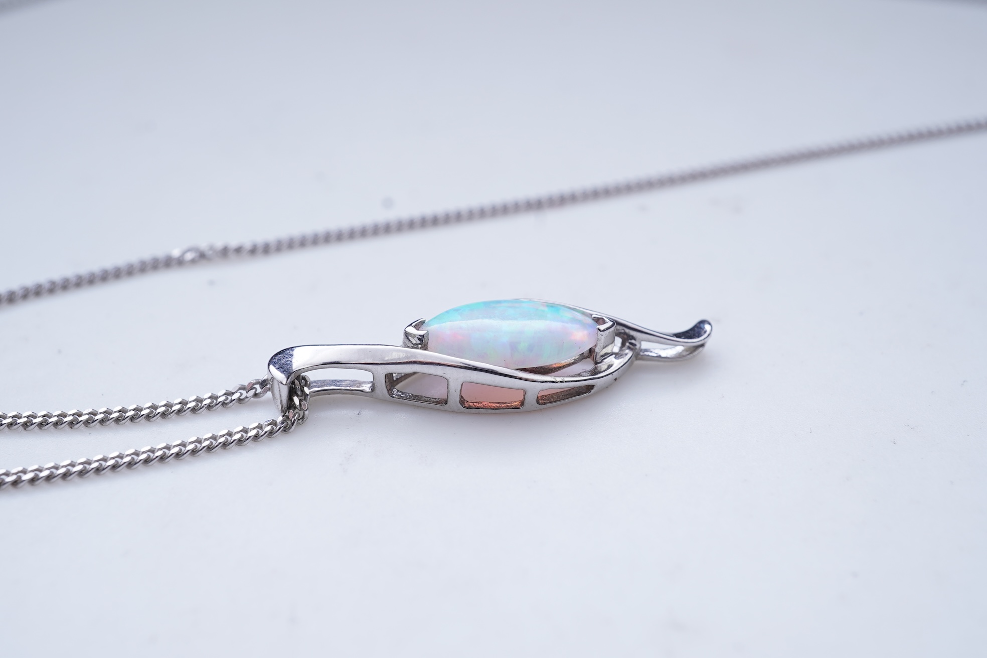 A synthetic opal demi-parure